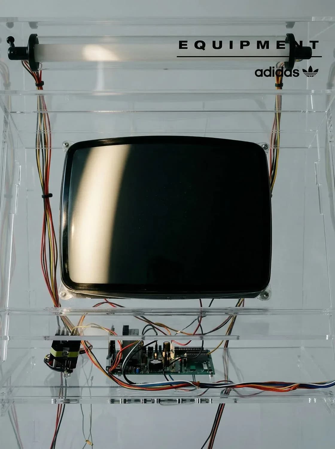 adidas Equipment display case with a screen and exposed wiring