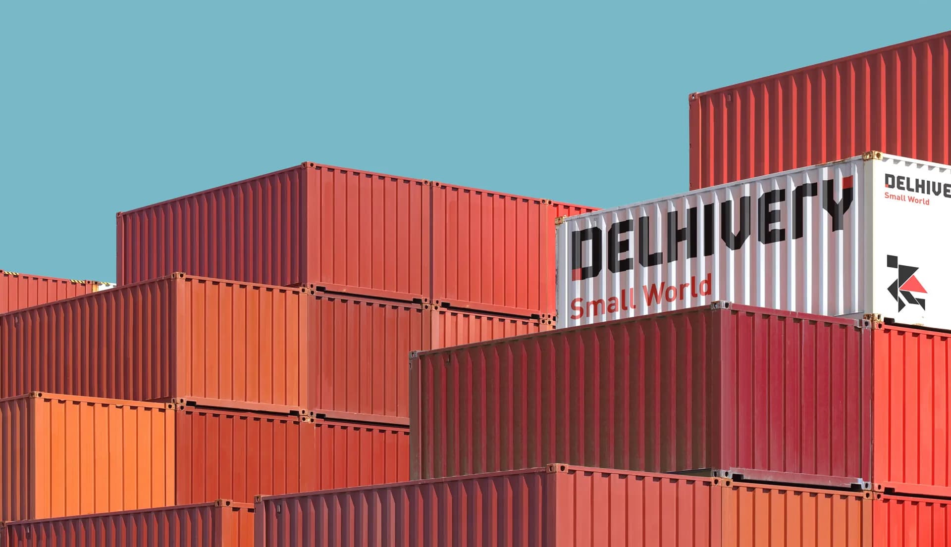 Stacked red Delhivery shipping containers