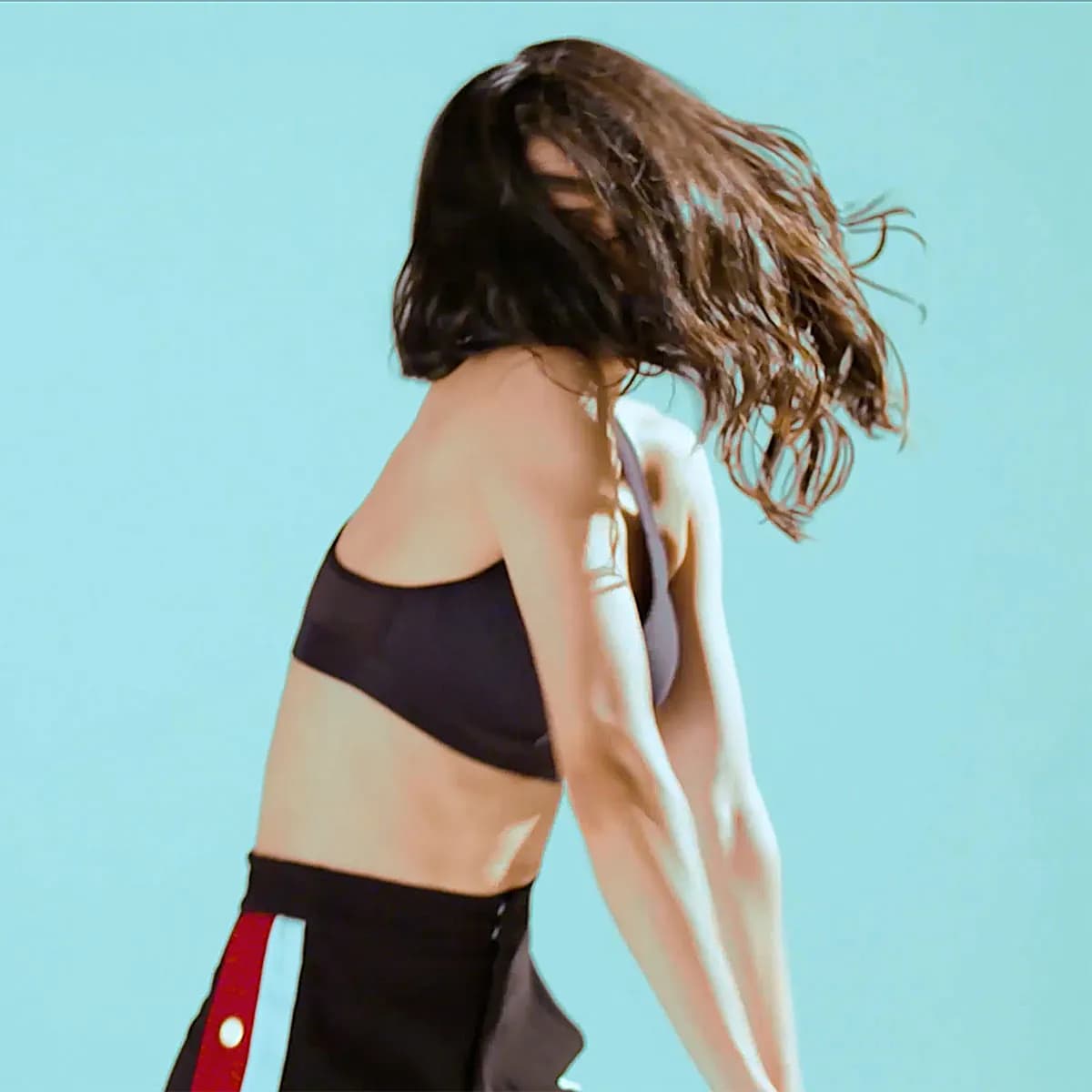 Dancer tossing her hair against mint, OnePlus campaign
