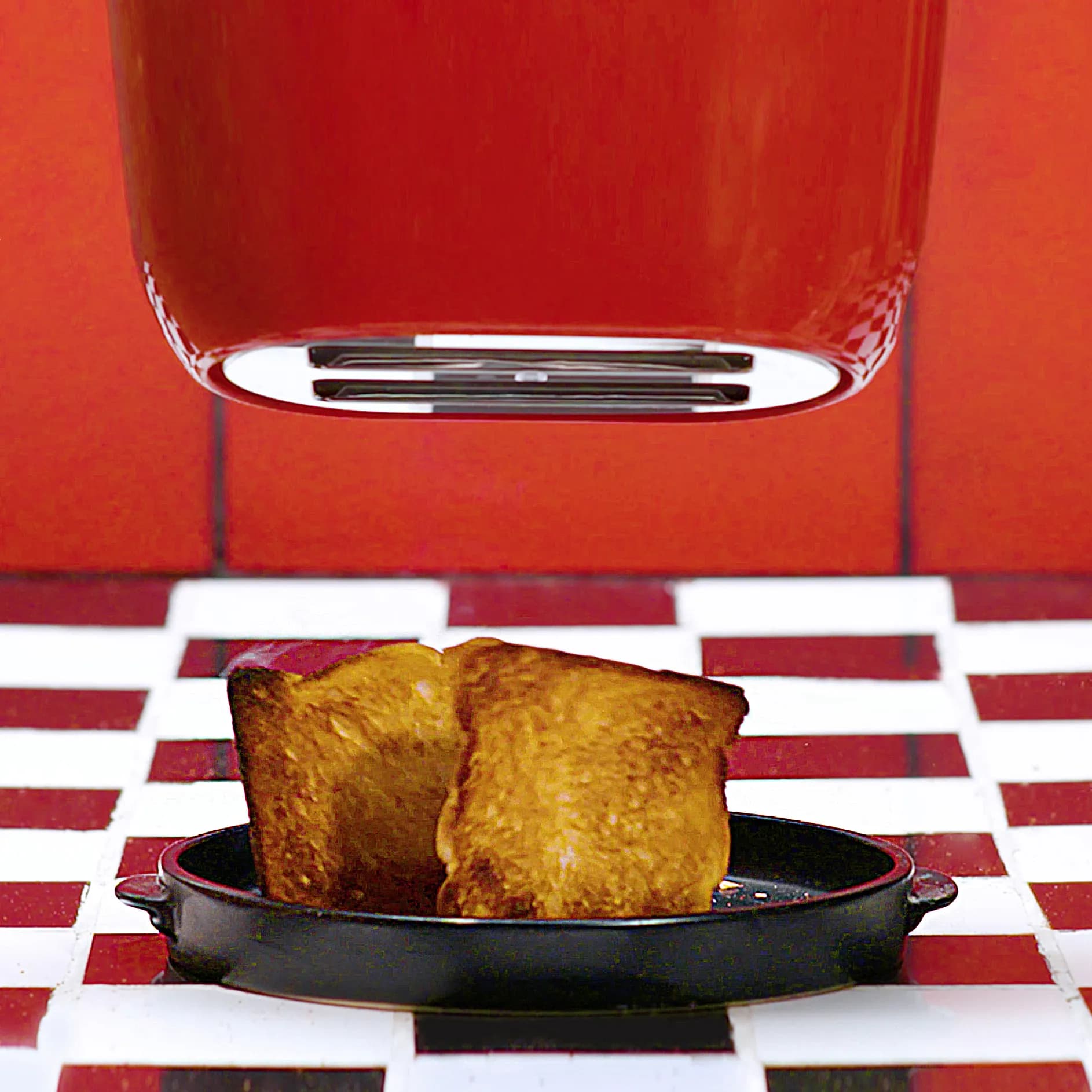 Red toaster with toast on a checkered floor, OnePlus campaign