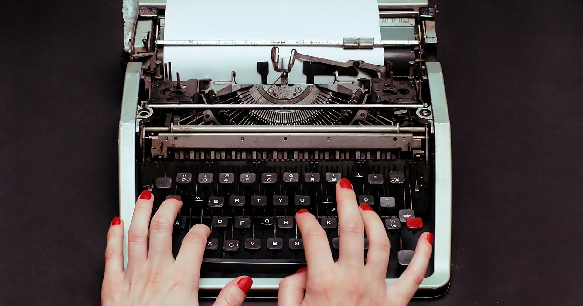 Hands typing on a vintage typewriter, OnePlus campaign